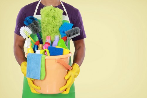 Cleaner in Barnet using protective gloves during a safe cleaning task