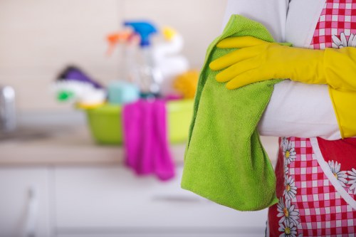 Cleaner wiping surfaces in an empty Barnet property before occupancy
