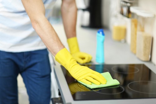 Manager discussing cleaning concern with staff member