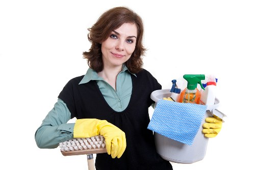 Local carpet cleaning technician working in a Barnet property hallway