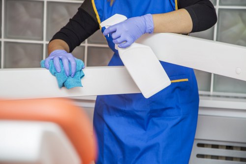 A cleaner reviewing property details before starting the booked cleaning service